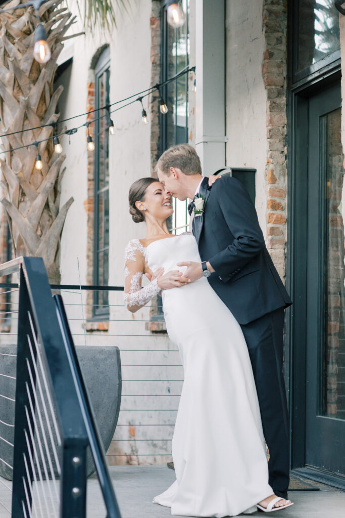 luxury wedding photographer | bride and groom laughing and kissing at columba sc wedding venue