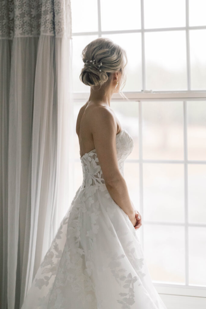 heron hill wedding | bride looking out window