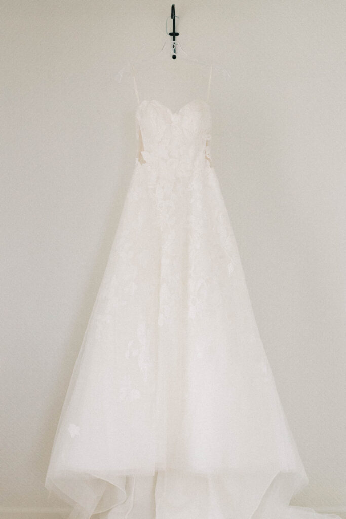 luxury photographer | Wedding dress hanging on hook