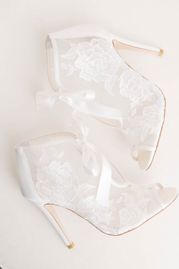 light and airy wedding photography | white pair of lace heels