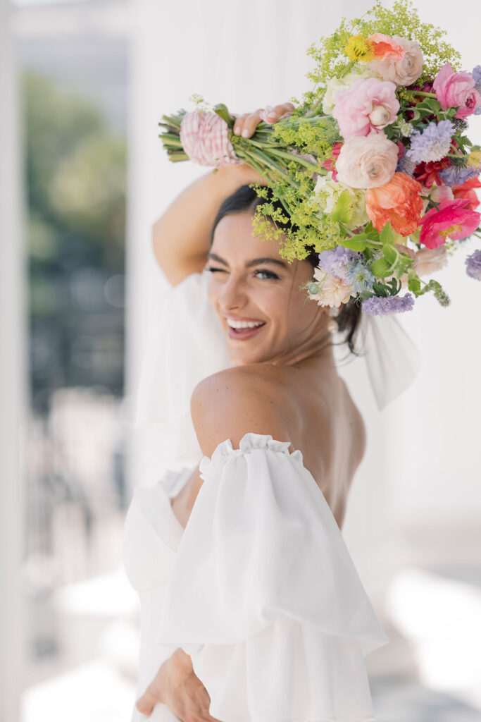 light and airy wedding photography bride holding colorful bouquet