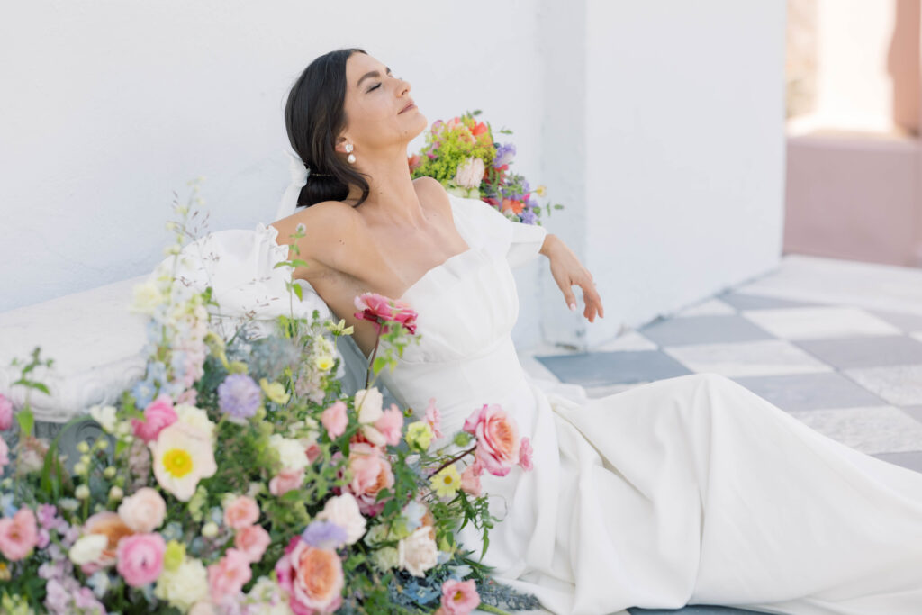 light and airy wedding photography Charleston Bride in floral arrangement