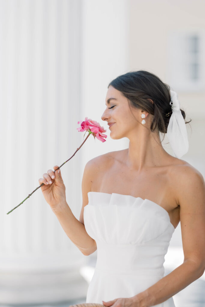 light and airy wedding photography bride sniffing flower