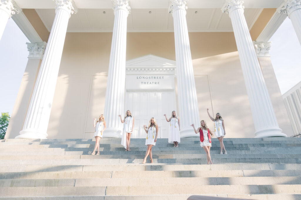 senior photos photographer near me | Group of senior girls on steps with columns