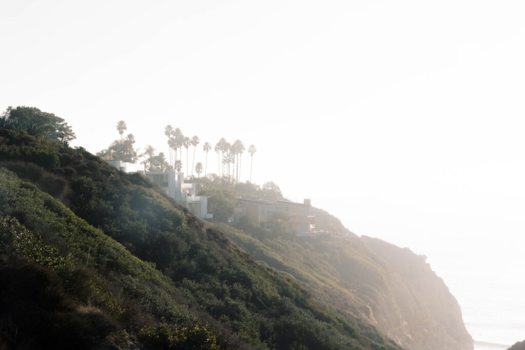 luxury destination wedding photographer | Mountain with palm trees at ocean