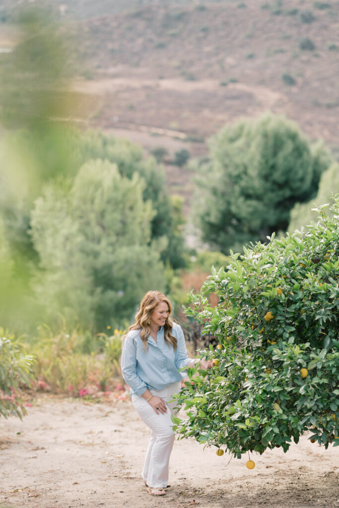 luxury wedding photographers | stee garman photographer looking at a lemon tree in the mountains of california