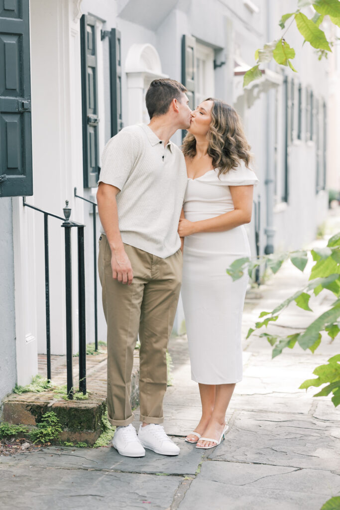 Engagement Photo Ideas in Charleston SC couple kissing on chalmers street