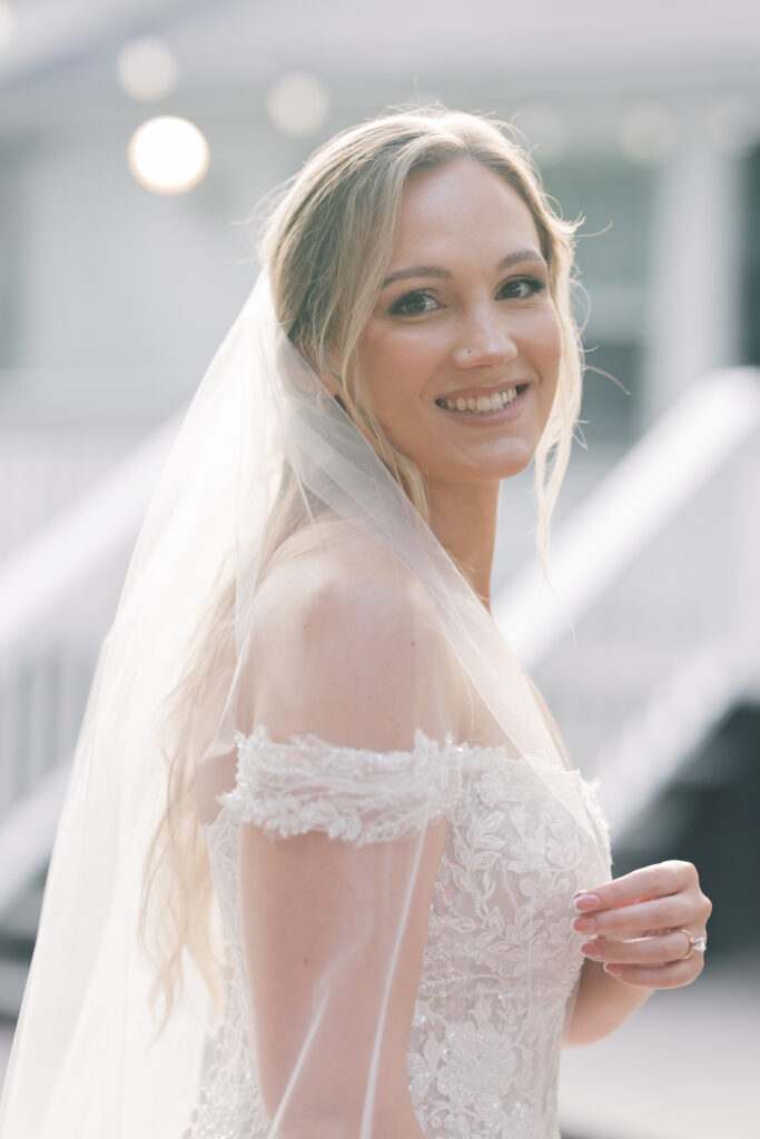 Bridal Portraits | bride holding veil in sunshine in gilbert sc