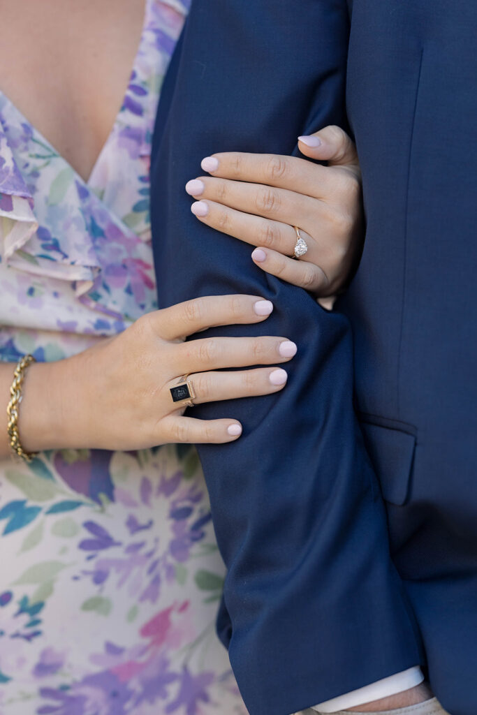 Engagement photos near me | couple with woman hands with rings