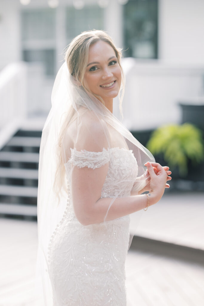 Bridal Portraits | bride smiling and turned to the side at southern oaks wedding venue