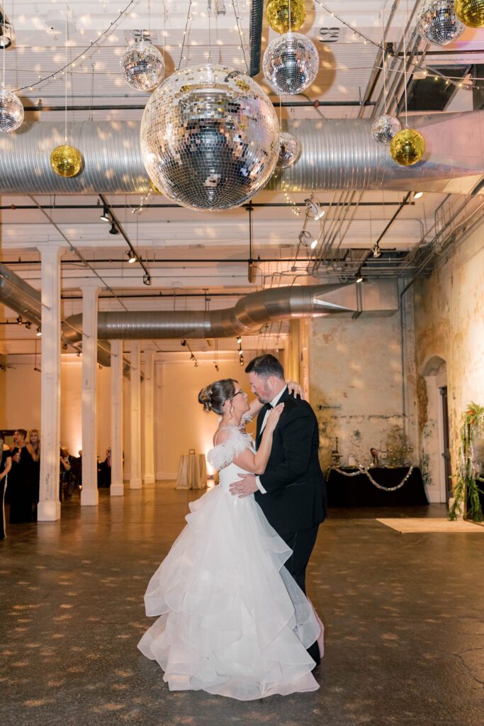 Columbia South Carolina wedding photographer | bride and groom dancing under disco balls at 701 whaley street