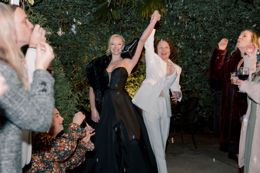 south carolina photographer | couple walking down the aisle with bubbles