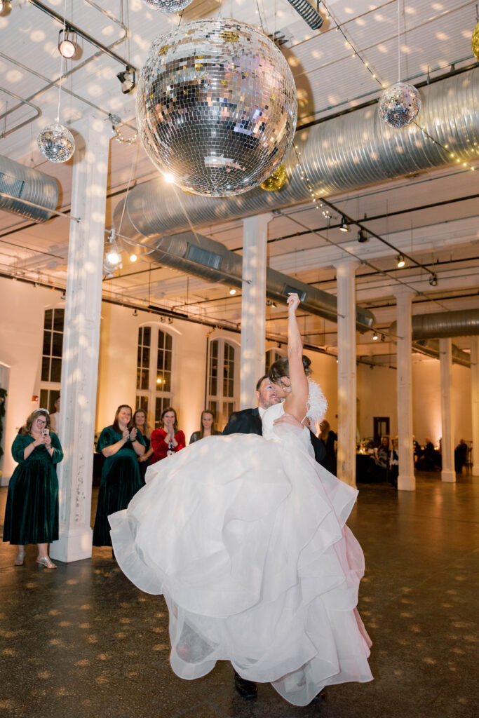 Columbia South Carolina wedding photographer | bride and groom spinning around under disco balls at 701 whaley street