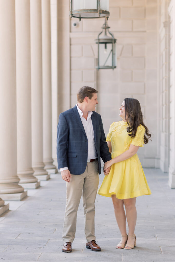 Engagement photographer near me | couple looking at each other at sc statehouse