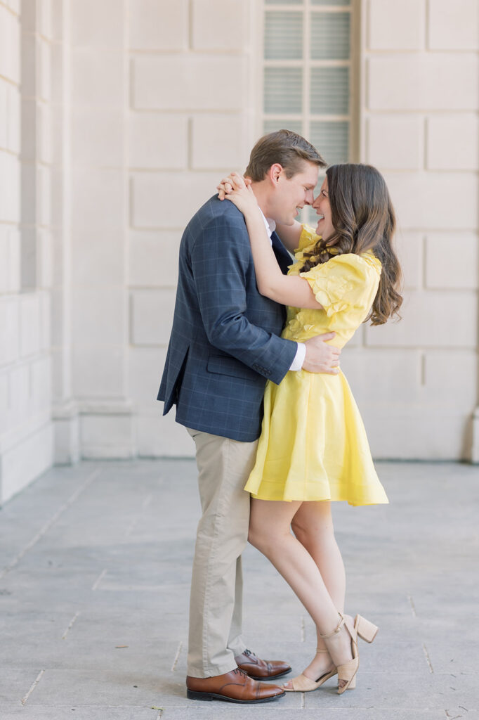 Engagement photographer near me | couple about to kiss at south carolina statehouse