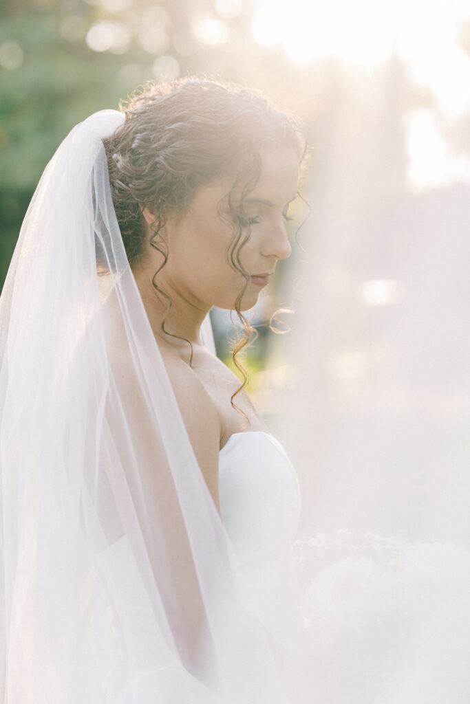  Bridal Portraits | bride looking down with sun rays