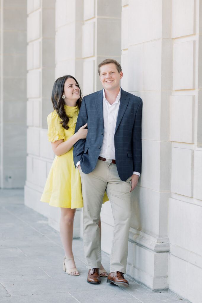 Engagement photographer near me | couple looking at each other at the south carolina statehouse