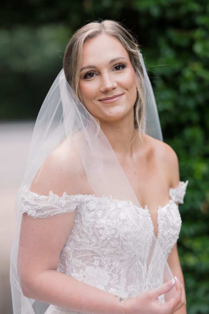 Bridal Portraits | bride looking at camera at southern oaks wedding venue