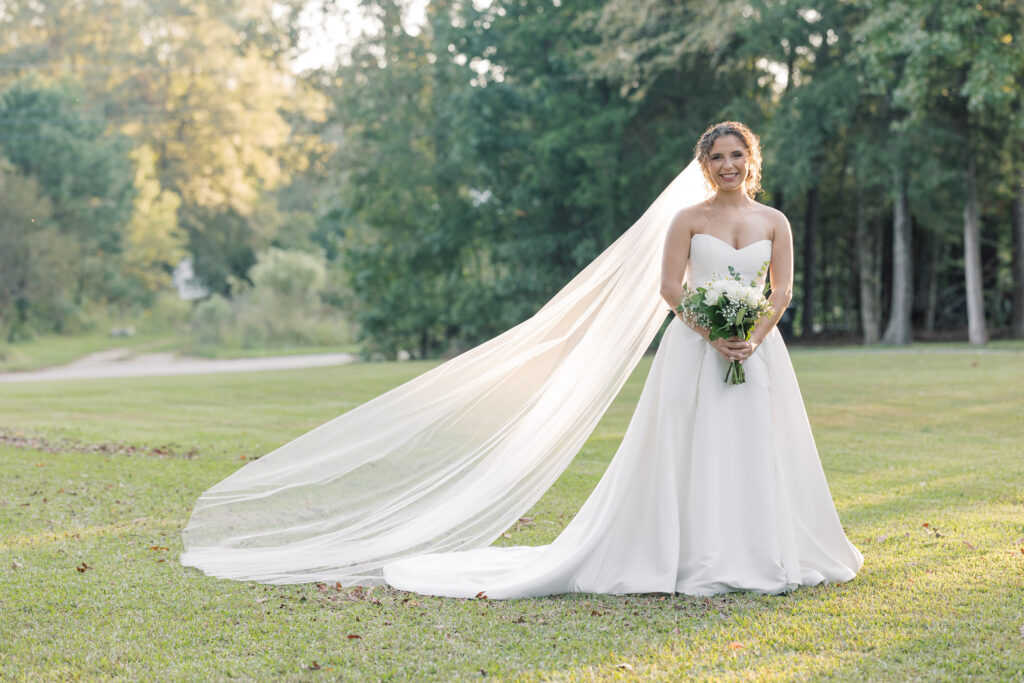  Bridal Portraits | bride with long veil smiling