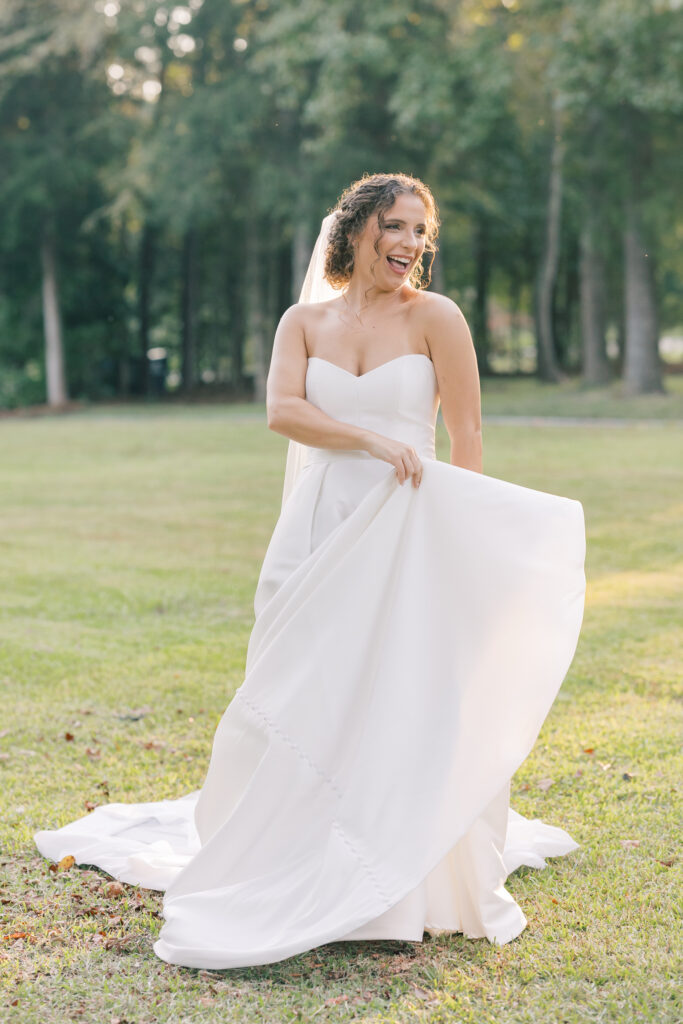  Bridal Portraits | bride playing with dress train