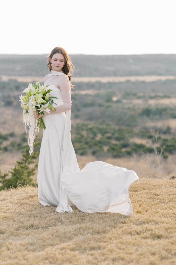 Bridal Portraits | Bride on wedding day looking down. Elopement at Contigo Ranch in Fredericksburg Texas