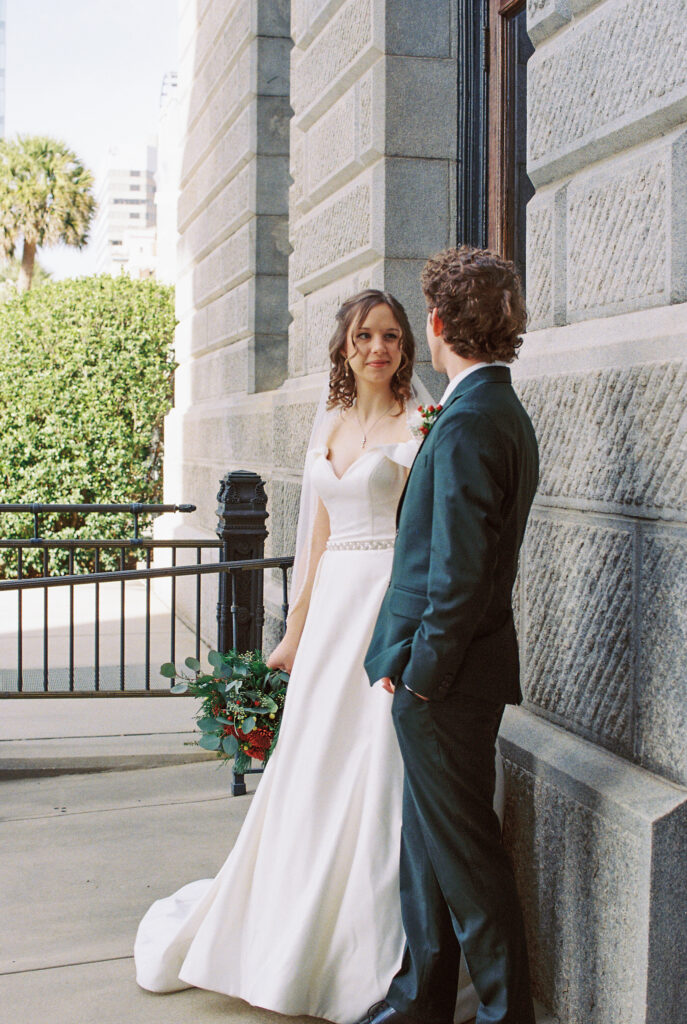 Top Film Photographers in South Carolina for Your Wedding | Couple looking at each other after wedding in Columbia, SC. Photographed in 35mm color fuji 400 film.