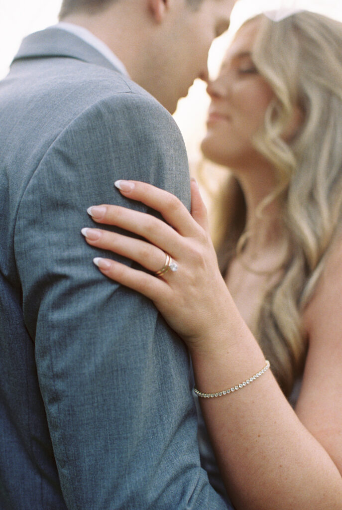  Film Photography | Intimate photo of bride and groom after wedding ceremony in Charleston, SC. Photographed in 35mm color fujifilm 400.