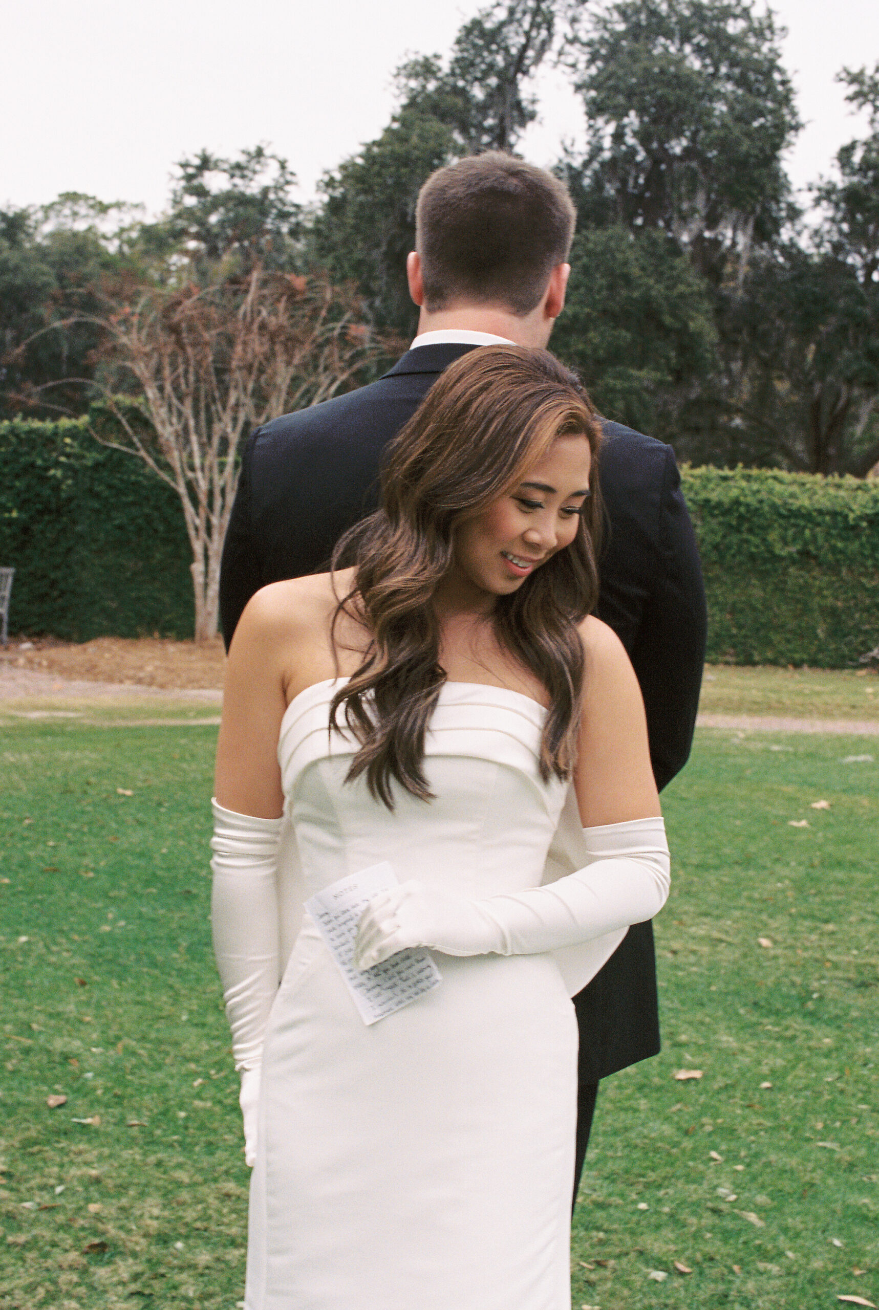 film wedding photographer | bride and groom share first look at wedding at Dunes West in Charleston SC.