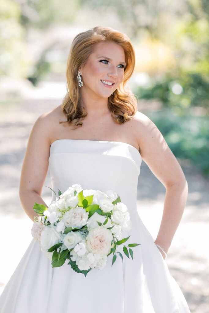 Best bridal portrait locations | Bridal portraits of bride in strapless dress in Charleston, SC. Bride is in a garden looking away.