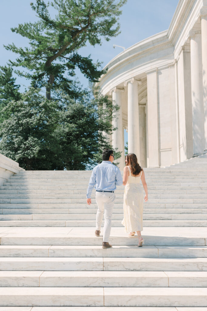 DC Engagement Photographer | Engagement session in Washington, DC | couple walking up the stairs in front of the Thomas Jefferson Memorial