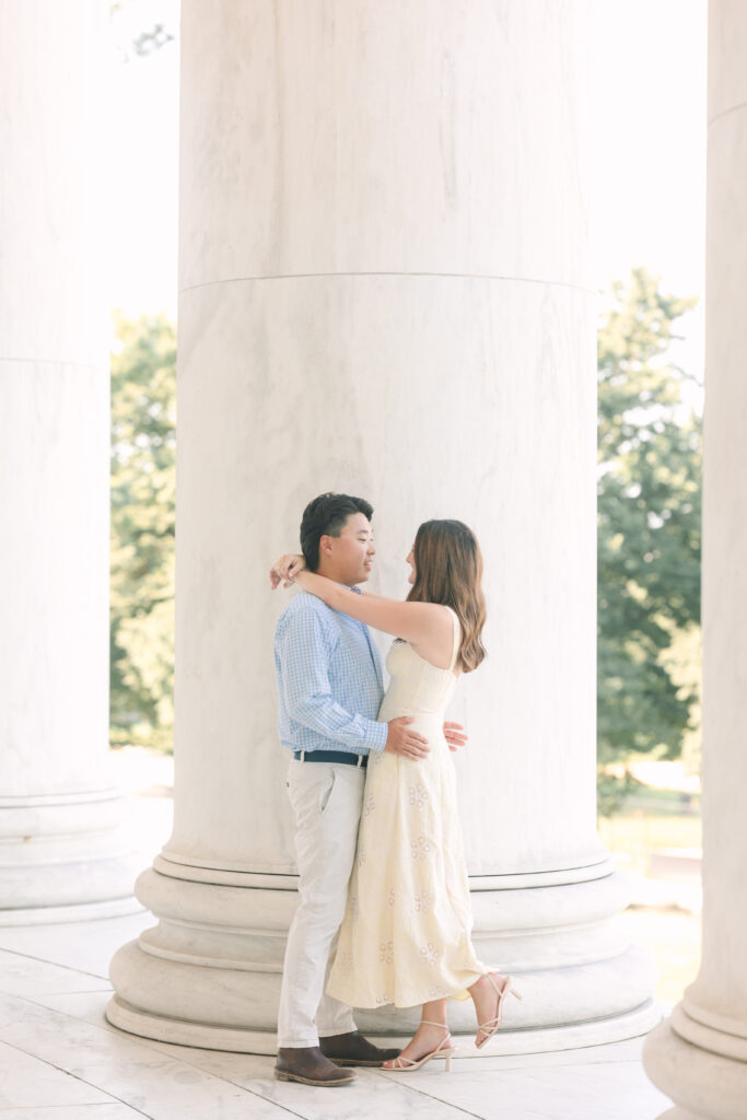 DC Engagement Photographer | Engagement session in Washington, DC | couple wrapped around each other at the Thomas Jefferson Memorial