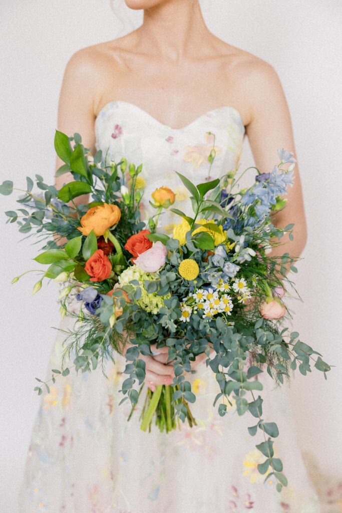 Bridal Portraits | Beautiful bridal bouquet with pops of color at 701 Whaley