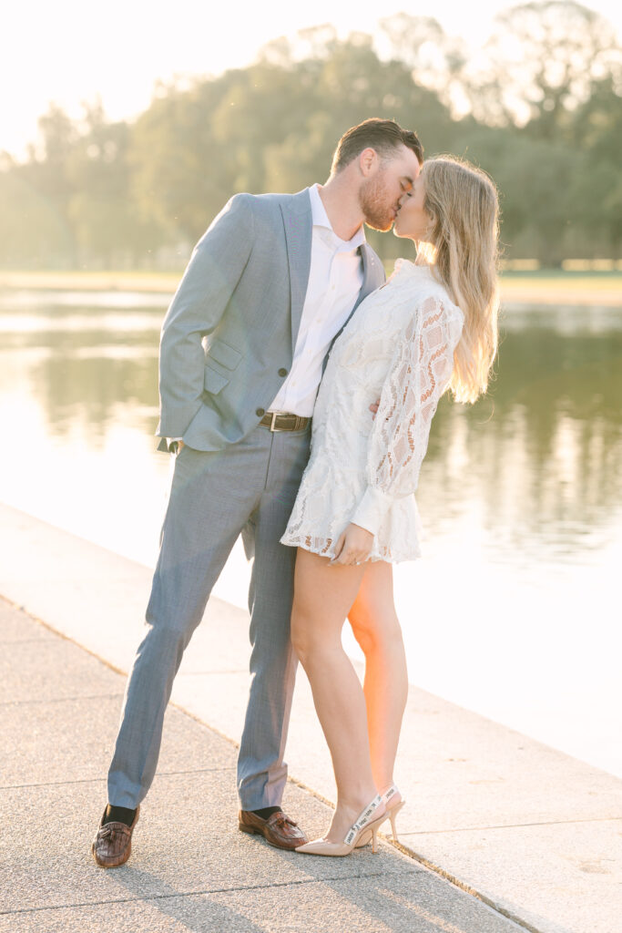 DC Engagement Photo | Couple kissing in front of the reflecting pool at the Lincoln Memorial in Washington DC