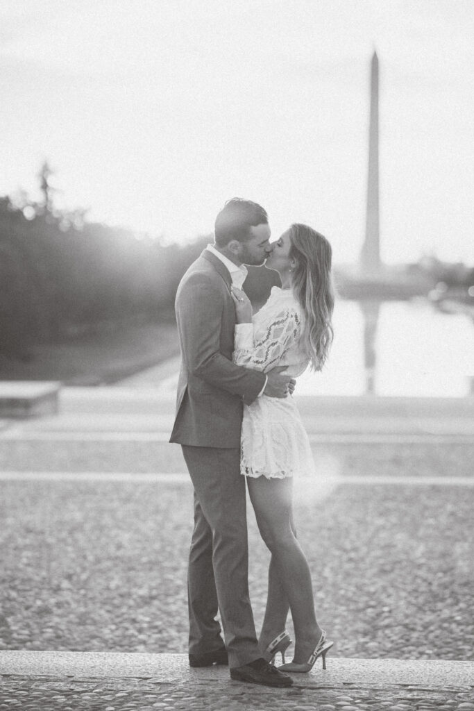 DC proposal photographer | Engagement Photography in DC | Where to propose in DC | Couple kissing in front of the Lincoln Memorial with the Washington Monument in the back