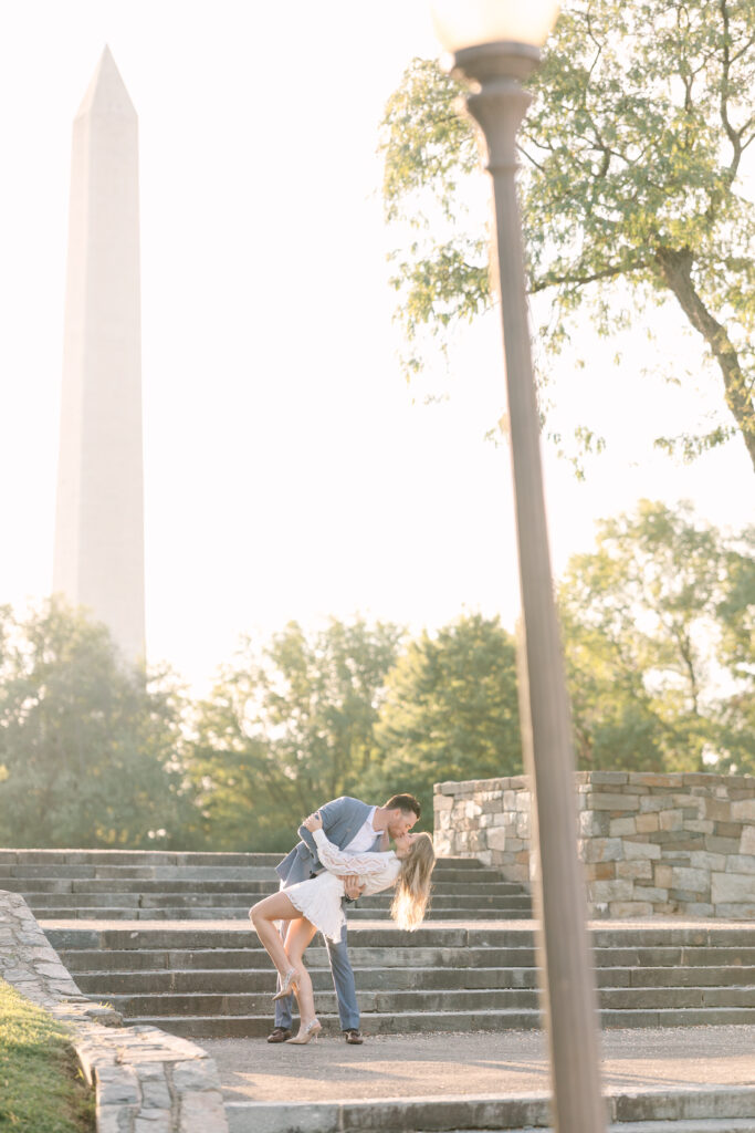 DC engagement photo locations | Couple in Washington DC | Couple dip kissing in front of the Washington Monument by staircase