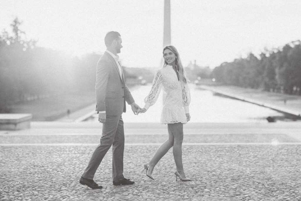 DC proposal photographer | Engagement Photography in DC | Where to propose in DC | Couple walking holding hands at the Lincoln Memorial