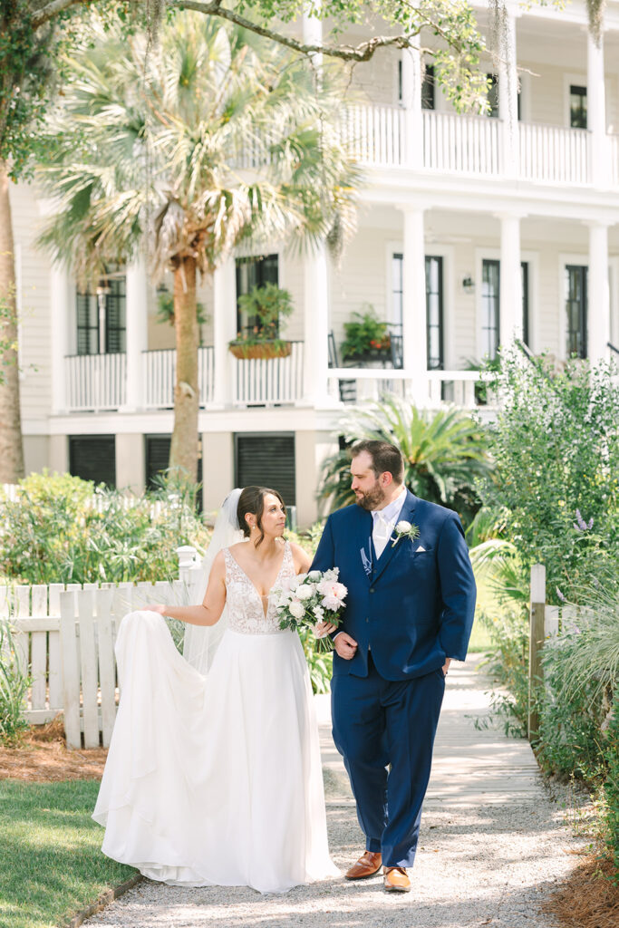 Charleston wedding Photographer | Creek at Ion Wedding | bride and groom walking away from grand white house