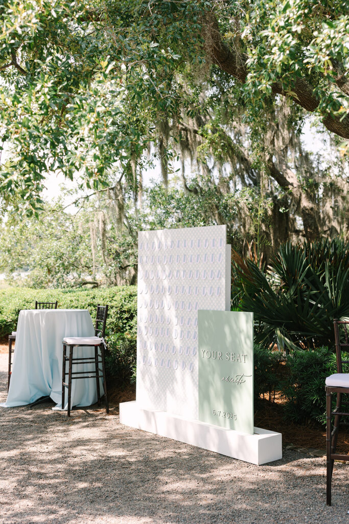 Charleston wedding Photographer | Creek at Ion Wedding | custom seating chart wall with paper oysters