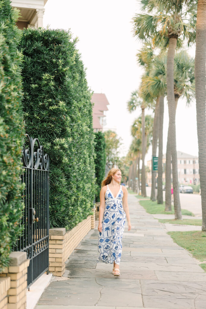 Charleston senior pictures | Senior session in Charleston SC | Senior walking down street with palm trees