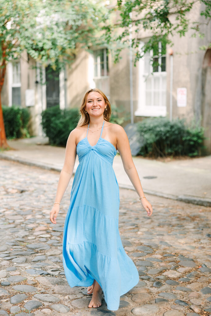 Charleston Senior Pictures | Senior Session in Charleston SC | senior wearing blue dress on cobblestone road