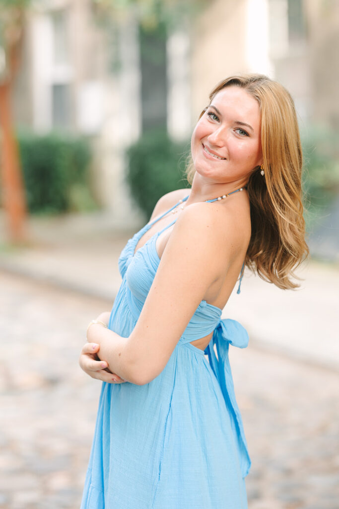 Charleston senior pictures | Senior session in Charleston SC | Senior in blue dress smiles at camera