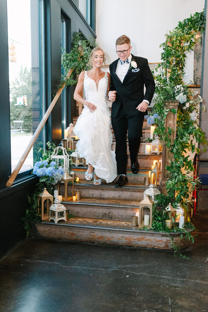 Columbia South Carolina Photographer | 701 Whaley Wedding|  bride and groom walk down grand stairwell during introductions