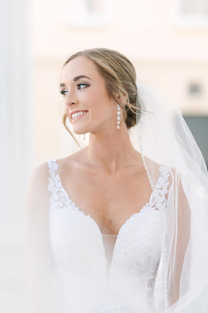 bridal portraits in Charleston | close up of bride looking off and veil floating