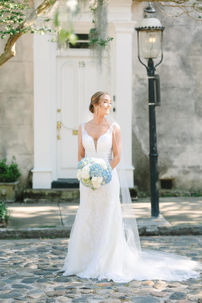 Charleston bridal portrait locations | bride in the sunshine on cobblestone street