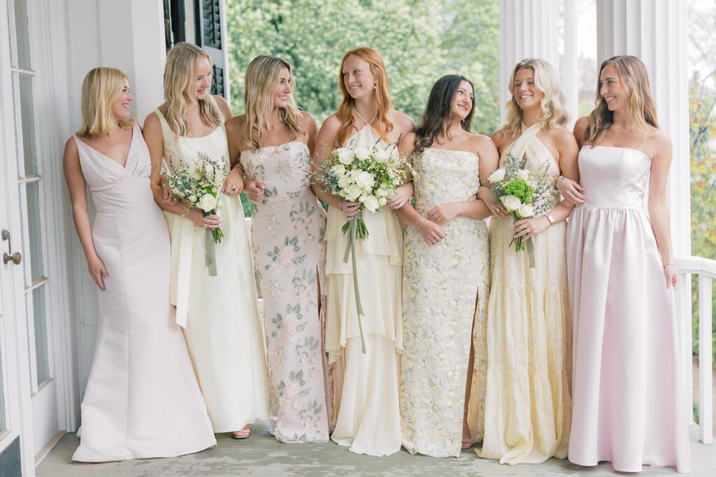 Columbia sc wedding photographer | Light and airy storytelling | Bridesmaids in pastel pinks and yellows at the Lace House in Columbia SC