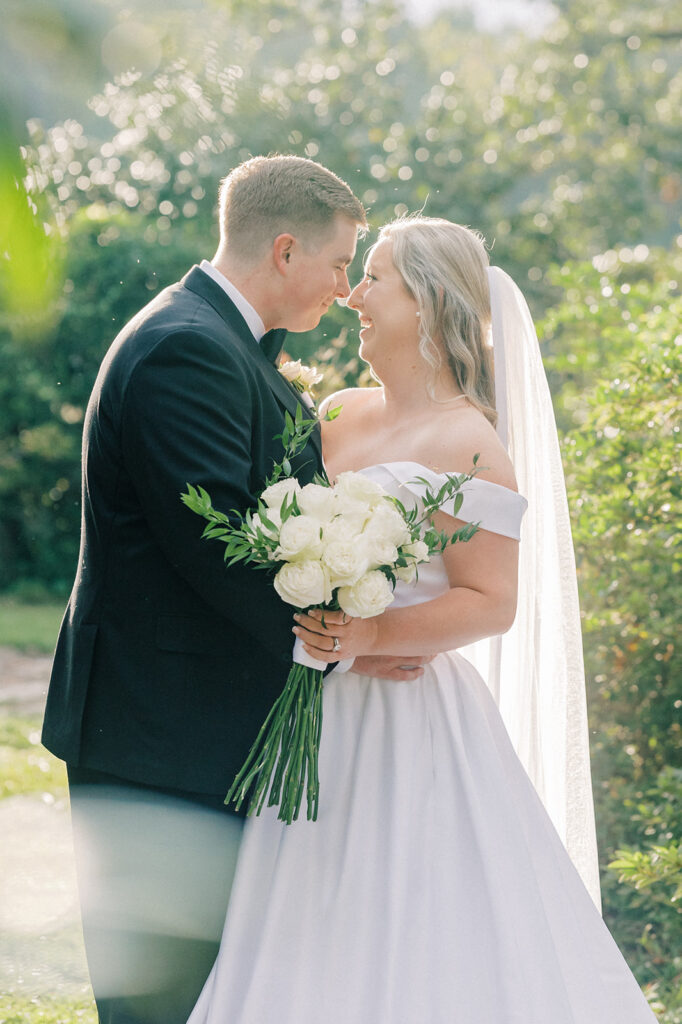 Heron Hill Wedding Venue | Gilbert SC | Chad and Kendall's wedding | couple smiling at each other in the sunlight after the wedding ceremony