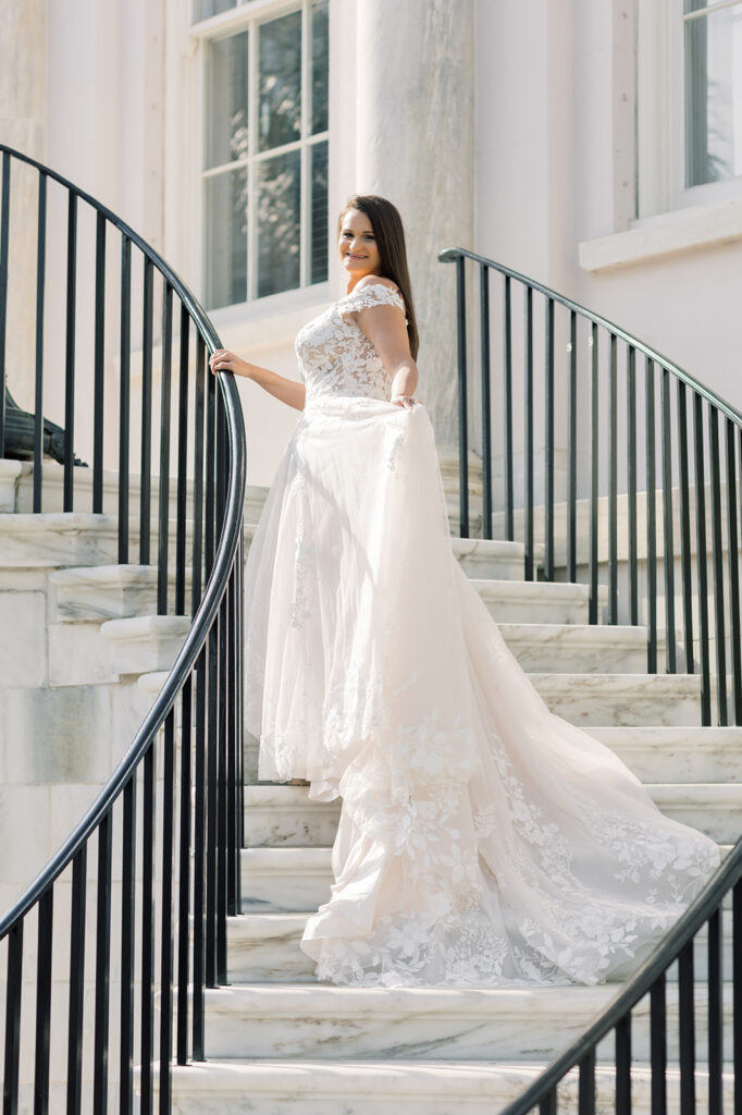 Bridal portraits | Bridal portrait in charleston SC | bride walking up stairs looking down holding train