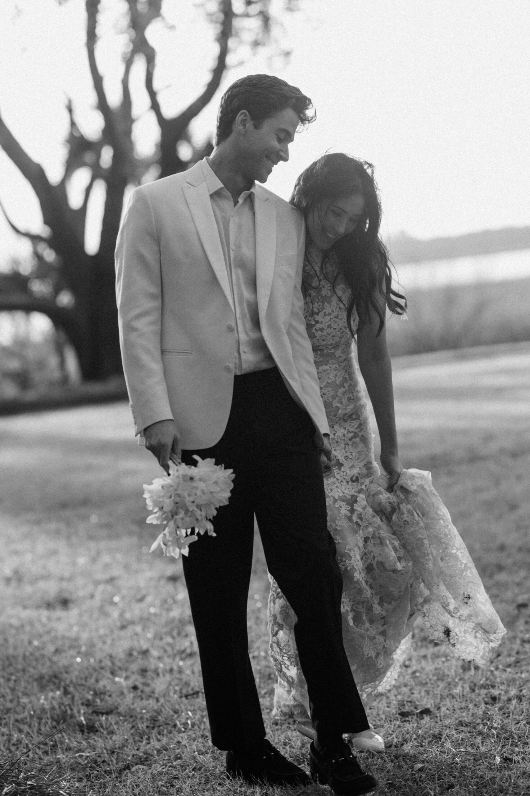 Black and white romantic couple portrait at Lowndes Grove Charleston waterfront wedding venue captured by Charleston wedding photographer Stee Garman Photography.